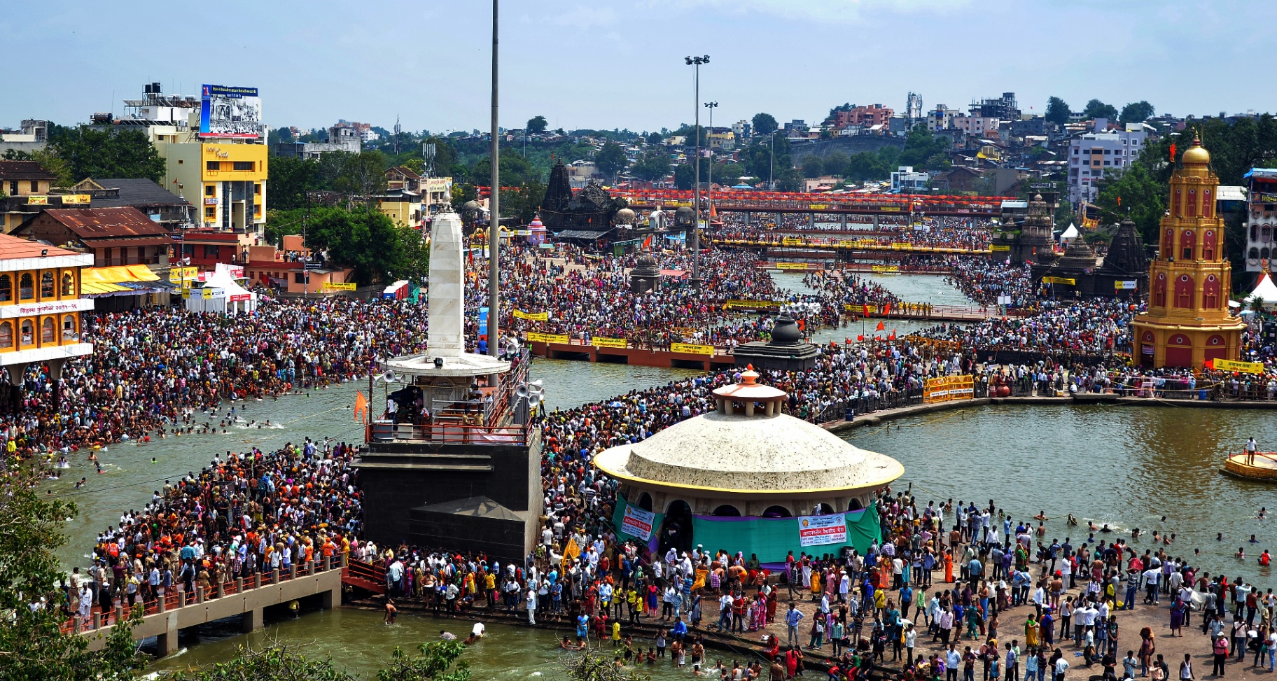 Pilgrims gathered along the ghats of the Godavari river during the Nashik Simhastha Kumbh Mela